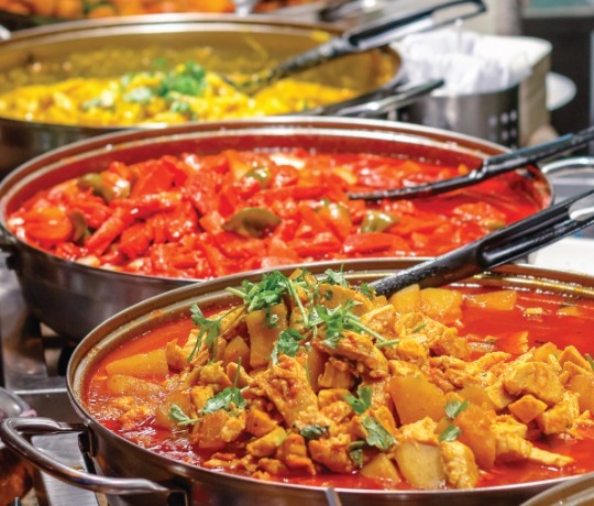 Authentic Indian Food from Dilli Heart Mix of curry dishes being served