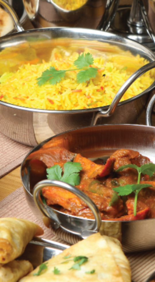 Authentic Indian Food from Dilli Heart rice and main in bowls served