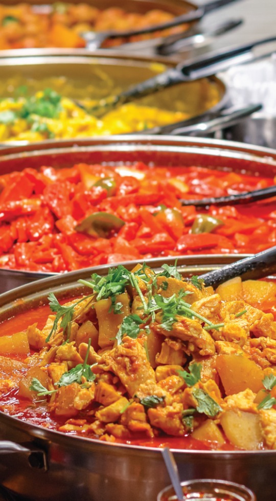 Mix of curry dishes for delivery, Milton Keynes Mix of curry dishes being served